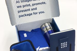 ImageMark branded promotional blog with a t-shirt, tumbler, notebook, and more.