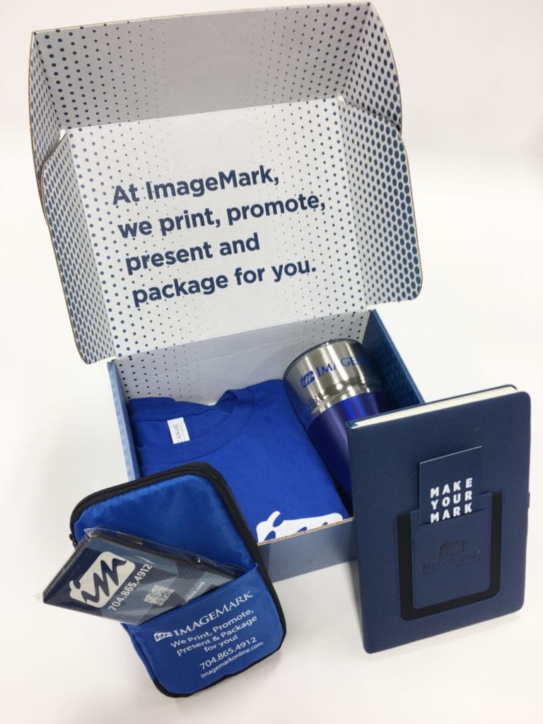 ImageMark branded promotional blog with a t-shirt, tumbler, notebook, and more.