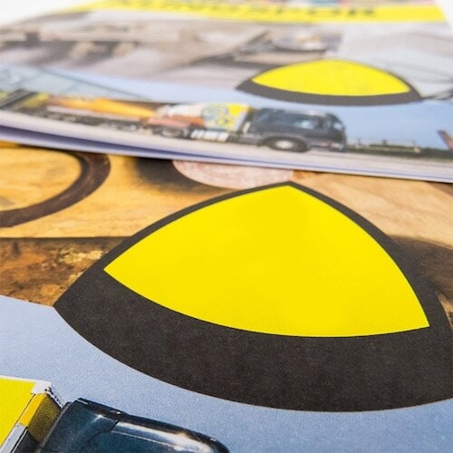 Yellow and blue design on printed direct mailers